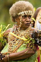 Woman performing in music and dance performance on Santa Ana Island, Solomon Islands. Santa Ana has a mixture of Melanesian and Polynesian traditions. They are famous for their pan pipes and perform a...