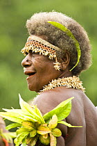 Woman at music and dance performance on Santa Ana Island, Solomon Islands. Santa Ana has a mixture of Melanesian and Polynesian traditions. They are famous for their pan pipes and perform a Mako Mako...