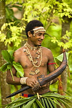 Man performing in music and dance performance on Santa Ana Island, Solomon Islands. Santa Ana has a mixture of Melanesian and Polynesian traditions. They are famous for their pan pipes and perform a M...