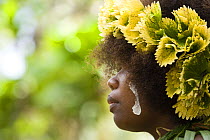 Young woman with traditional leaf headdress, Nembao Village, Utupua Island, Solomon Islands May 2008