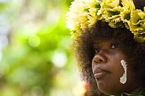 Young woman with traditional leaf headdress, Nembao Village, Utupua Island, Solomon Islands May 2008