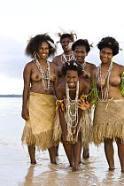 Young women in traditional grass skirts, Rano Island, Vanuatu May 2008