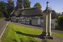 Thatched cottages and memorial, Wherwell, nr Andover, Hampshire, UK