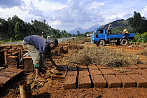 Man making bricks for houses, Rwanda, Africa, 2008