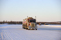 Truck on the ice road transporting fuel to the mines, Northwest Territories, Canada