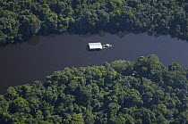 Aerial view of Anavilhanas Ecological Station and its headquarters in floating houses on "igapó" flooded Amazon Rainforest, in Negro River, north of Manaus city, Amazonas State, Northern Brazil.