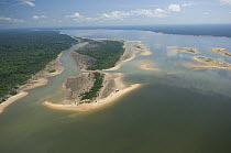 Aerial view of Amazon black water lake and Amazon rainforest near Nova Olinda do Norte town, Amazonas State, Northern Brazil.