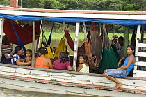 Boat with riverside people at the Pucu channel, between Barreirinha town and Freguesia do Andirá village, municipality of Barreirinha, Amazonas State, Northern Brazil.