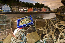 Fishing nets and lobster pots on the pier. Tobermory harbour, Isle of Mull, Scotland, UK.