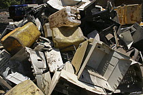 Scrapped computers, electronics and plastic containers, stripped of recyclable parts, The Gambia, 2008