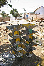 Pile of stoves made from scrap metal reclaimed from traditional taxis, The Gambia, 2008