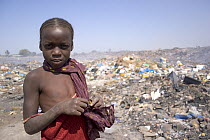Portrait of Gambian girl sifting for aluminium scrap, Mannjai Kunda rubbish dump, The Gambia, 2008