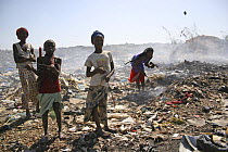 Gambian girls and women sifting for aluminium scrap, Mannjai Kunda rubbish dump, The Gambia, 2008