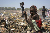 Gambian girls searching for aluminium scrap in Mannjai Kunda rubbish dump, The Gambia, 2008