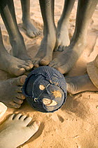 Feet touching a football made from old fabric, The Gambia, 2008