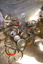 Offcuts from drinks cans being crafted by artisan, Dakar, Senegal, 2008