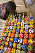 Grid of recycled bottle tops threaded on wire, Dakar, Senegal, 2008