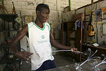 Artisan crafting candle holders from wire, Dakar, Senegal, 2008
