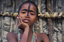 Young San Bushman with face decoration of oryx mask, Bushmanland, Namibia
