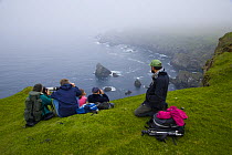 Bird watchers at Hermaness Nature Reserve, Unst Island, Shetland Islands, Scotland, UK
