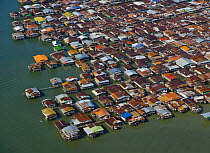 Aerial view of homes built on stilts on edge of river, Kinabatangan River, Sandakan, Sabah, Malaysia  2007