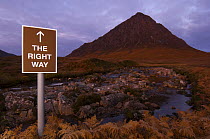 Spoof tourist sign in front of Buachaille Etive Mor, Argyll, Scotland, UK, October 2007