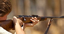 Man shooting gun, South Africa. 2009.