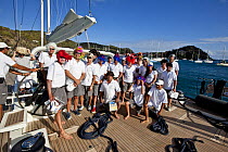 Crew members wearing wigs, Saint Barths Bucket Super Yacht Regatta, Caribbean, March 2009.