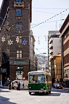 Trolebus travelling through city, Valparaiso, Chile 2008.