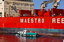 Container ship with small boat alongside. Valparaiso, Chile 2008.