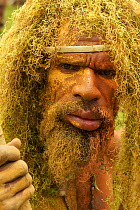 Man wearing hanging lichen (spanish moss?) headdress. Goroka, Eastern Highlands Province, Papua New Guinea. September 2004