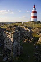 Ruined cottages and the Daymark, erected in 1683. St.Martin's, Isles of Scilly December 2008.