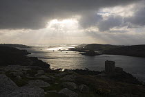 Stormy skies over Cromwell's Castle, Bryher and Tresco Sound. Tresco, Isles of Scilly. December 2008.