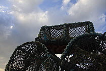 Stack of lobster pots on New Grimsby Beach, Tresco, Isles of Scilly. December 2008.