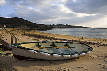 Rowing boat pulled up on New Grimsby Beach, Tresco, Isles of Scilly. December 2008.