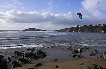 Kite surfers on Bantham Bay, with Burgh Island in the distance. South Devon, UK. January 2009.