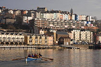 Men's crew practicing in Pilot Gig "Isambard" on Bristol Floating Harbour in the morning, February 2009.