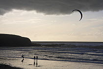 Kite surfers on Bantham Bay under stormy skies, South Devon, UK. January 2009.