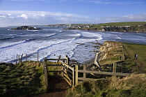 Gate on coastal path near Bantham Bay, with Burgh Island in the distance. South Devon, UK. January 2009.