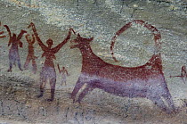 Prehistoric rock painting of men and beast, Bhimlat  Rajasthan, India