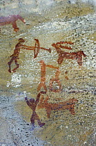 Prehistoric rock painting of men hunting, Bhimlat, Rajasthan, India.