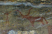 Prehistoric rock painting of man and horned animal, Bhimlat, Rajasthan, India