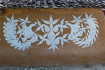 Traditional painting on mud wall of house during Diwali festival, Bada Gaire Killa village, South of Tonk, Rajasthan, India