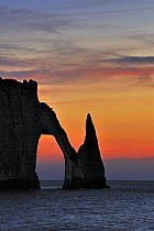 L'Aiguille and The Porte D'Aval at sunset, a natural arch in the chalk cliffs at Etretat, Normandy, France