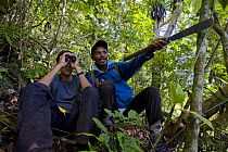 Scientists monitoring Silky sifakas {Propithecus diadema candidus} Marojejy National Park, Sambava, North east Madagascar.