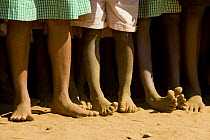 Legs of children at a party to celebrate the 5th of June, World Environment Day, Manerinerina, Majunga, Madagascar.