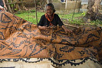 Woman showing off her tapa cloth, Tonga, Melanesia, 2007 .