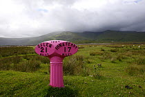 Pink road sign on Isle of Mull, Inner Hebrides, Scotland, UK