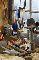 Garden tools, secateurs and shears on workshop bench, ready to be cleaned and sharpened, UK, December 2008