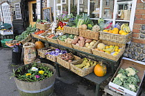 Fruit and vegetables displayed outside traditional village grocery shop, Cley, Norfolk, UK, November 2008